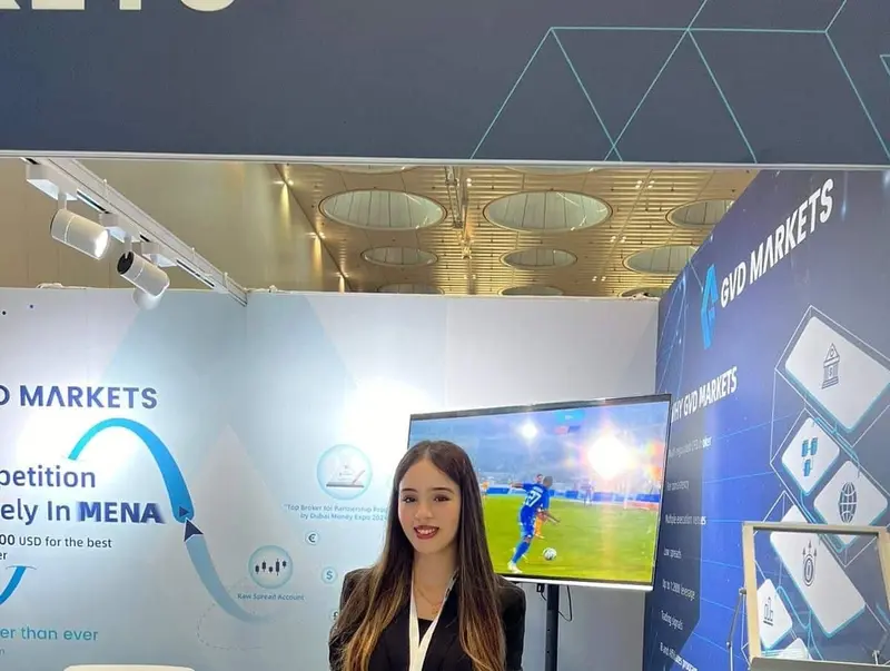 Exhibition hostess welcoming visitors at a company stand in Dubai